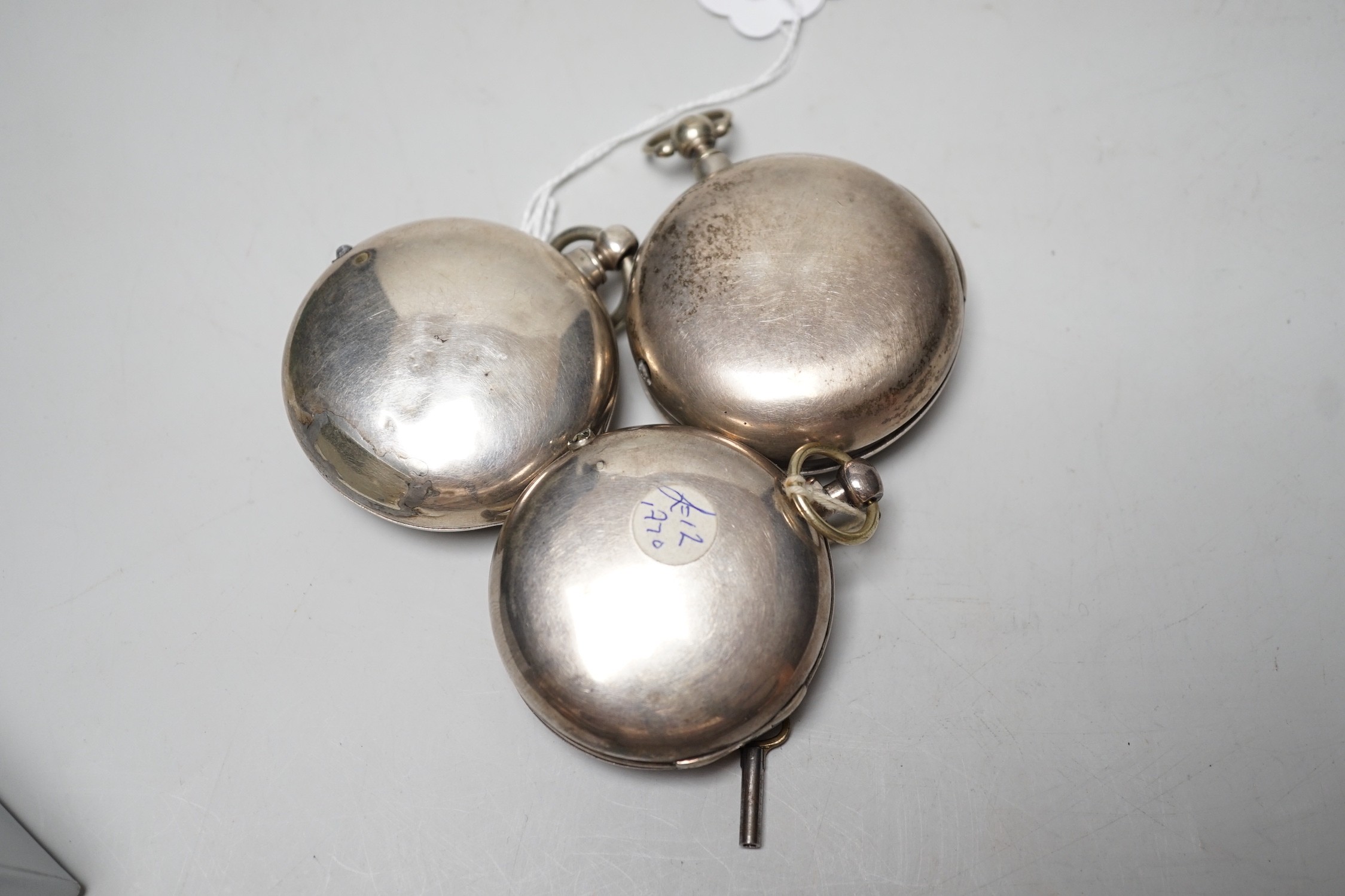 Three 19th century silver pair cased keywind verge pocket watches, by Graham, London, one signed WG, the other unsigned.